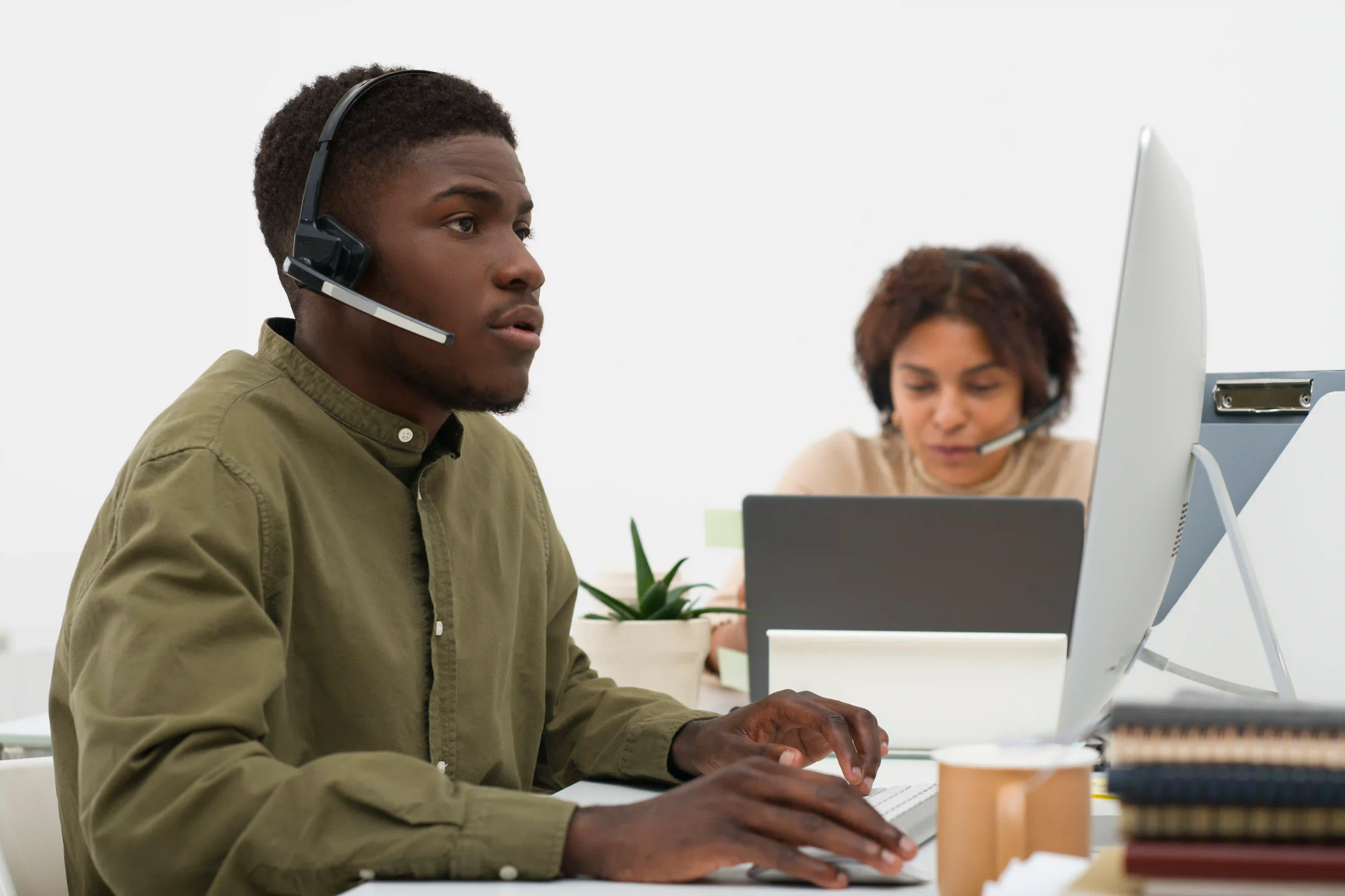 IT technician assisting a client with hardware setup
